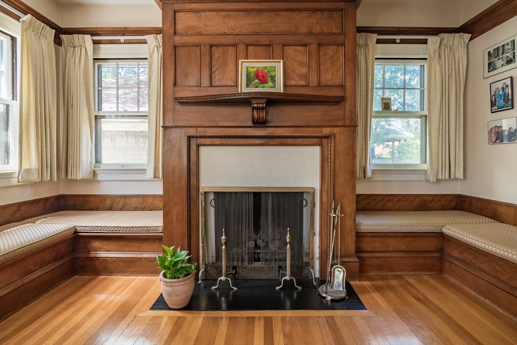 128 Maplewood Terrace Springfield, MA 01108 - Photo 11 of 42 a view of a living room with a fireplace and large windows