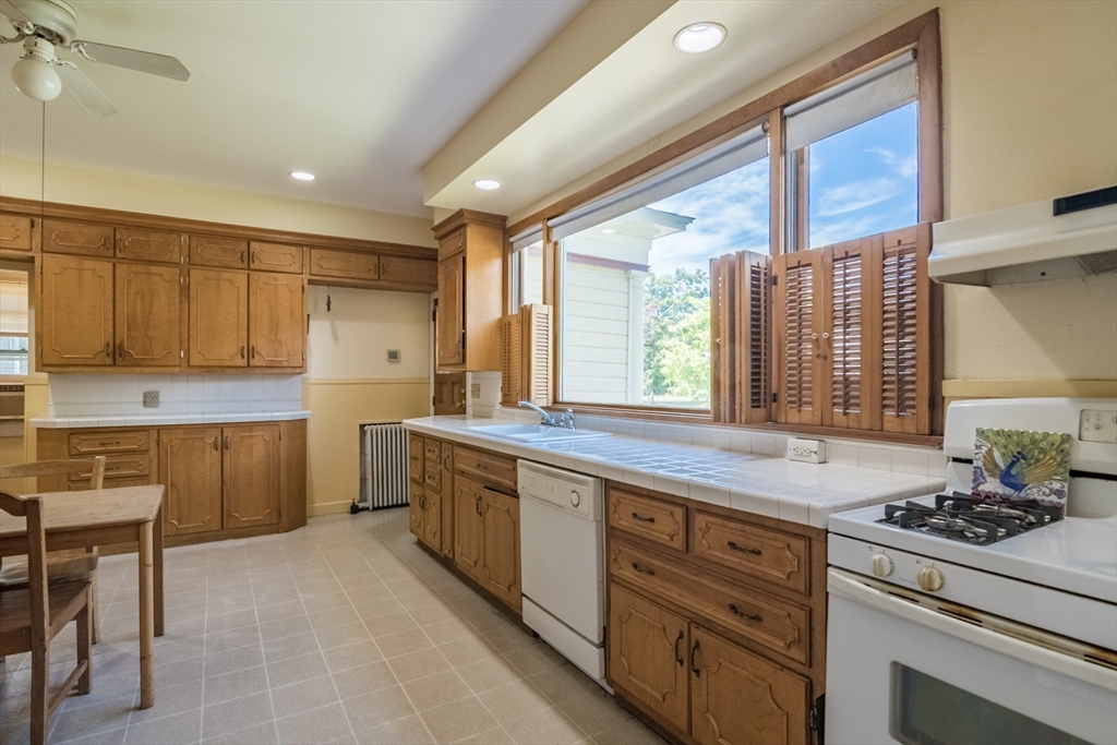 128 Maplewood Terrace Springfield, MA 01108 - Photo 16 of 42 a kitchen with a stove a sink and a refrigerator