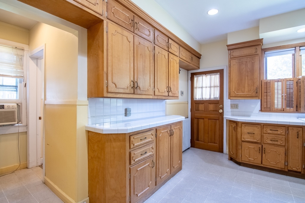 128 Maplewood Terrace Springfield, MA 01108 - Photo 17 of 42 a kitchen with stainless steel appliances granite countertop a sink a stove and a refrigerator