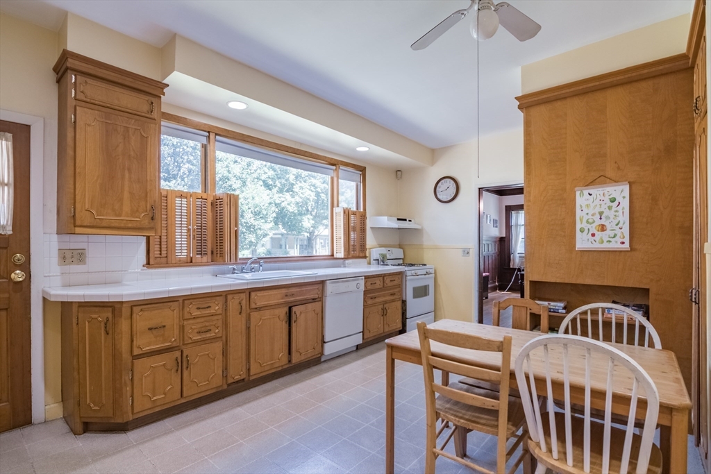 128 Maplewood Terrace Springfield, MA 01108 - Photo 18 of 42 a large kitchen with a table and chairs