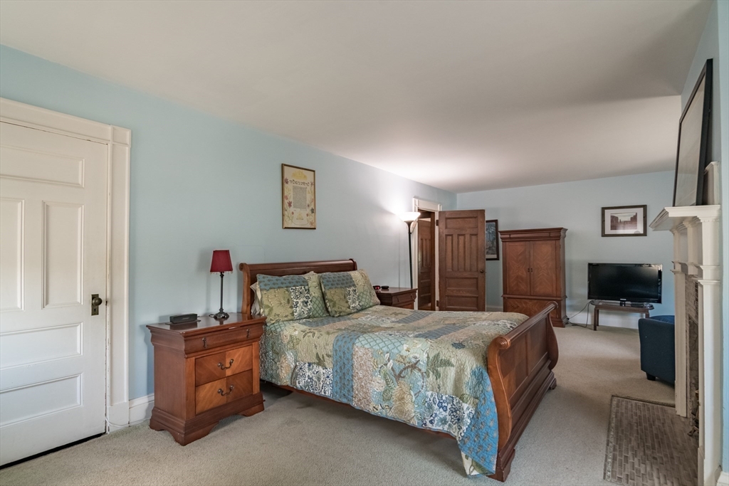 128 Maplewood Terrace Springfield, MA 01108 - Photo 20 of 42 a bedroom with a bed and wooden floor