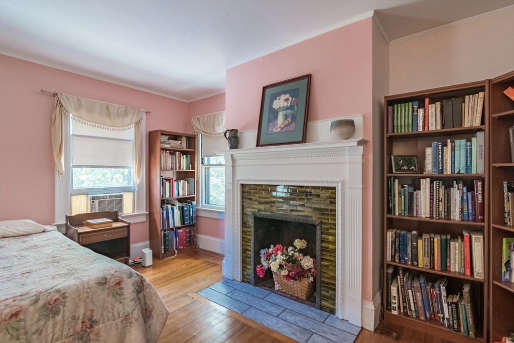 128 Maplewood Terrace Springfield, MA 01108 - Photo 26 of 42 a view of a livingroom with a bookshelf and a fireplace