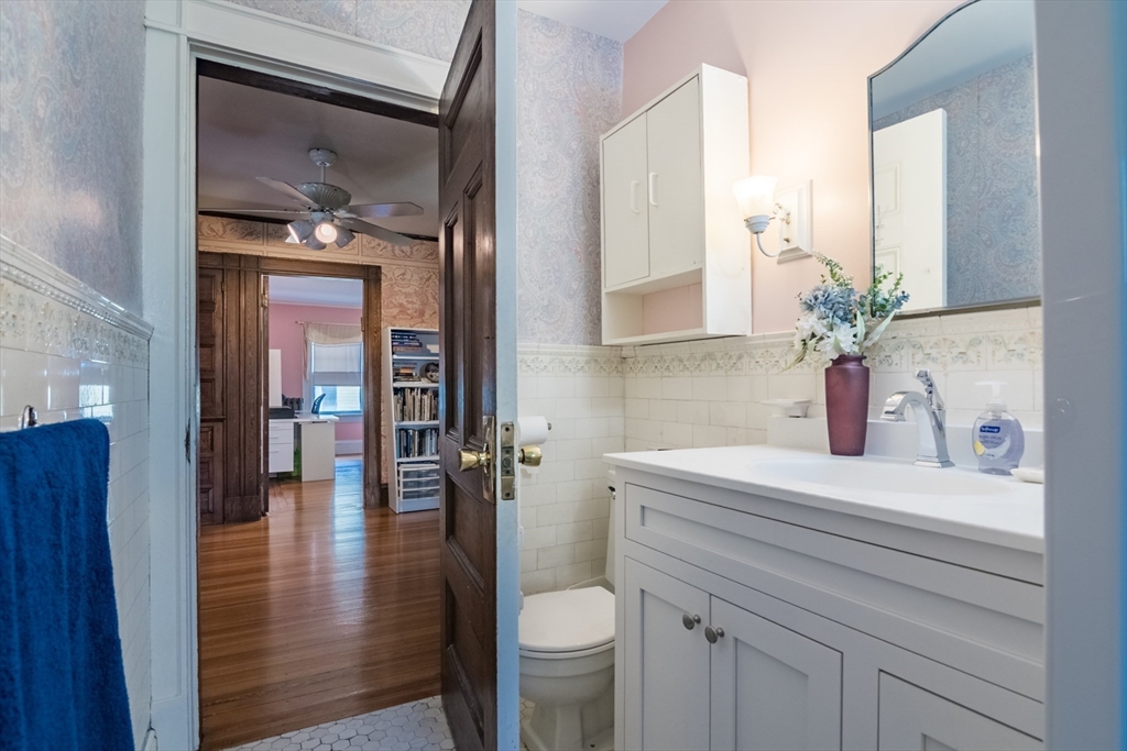 128 Maplewood Terrace Springfield, MA 01108 - Photo 28 of 42 a bathroom with a sink a toilet and a mirror
