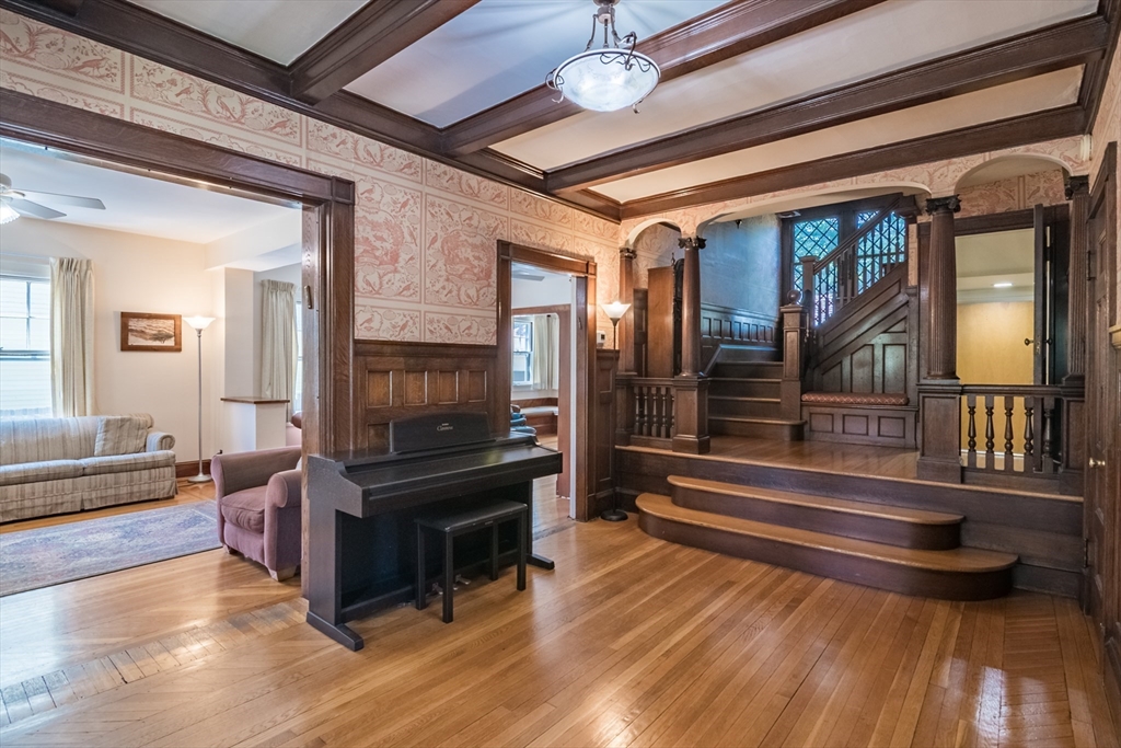 128 Maplewood Terrace Springfield, MA 01108 - Photo 10 of 42 a living room with fireplace furniture and a wooden floor