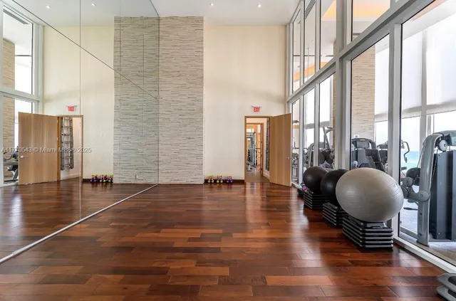 a living room with a couch and a potted plant
