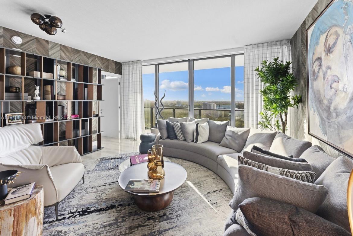 1451 Brickell Avenue, Unit 2505 Miami, FL 33131 - Photo 18 of 30 a living room with furniture and a large window