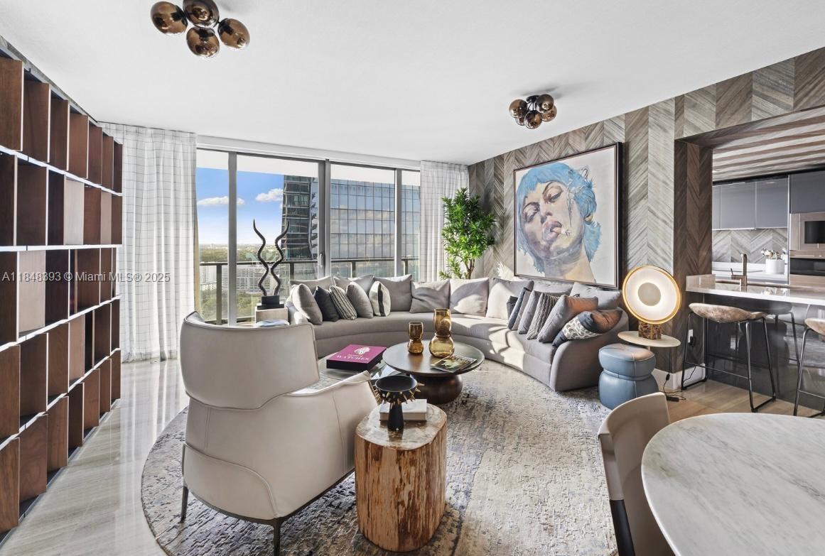 1451 Brickell Avenue, Unit 2505 Miami, FL 33131 - Photo 20 of 30 a living room with furniture and a large window