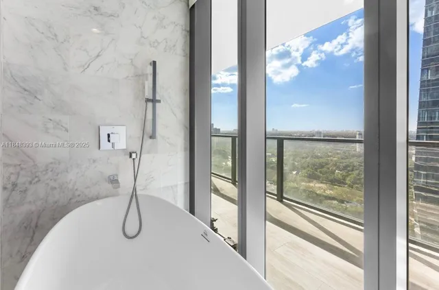 a living room with blue lights with furniture