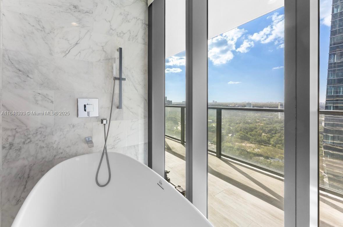 1451 Brickell Avenue, Unit 2505 Miami, FL 33131 - Photo 23 of 30 a bathroom with a shower