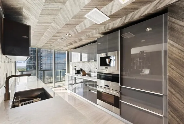 a room with lots of appliances and furniture