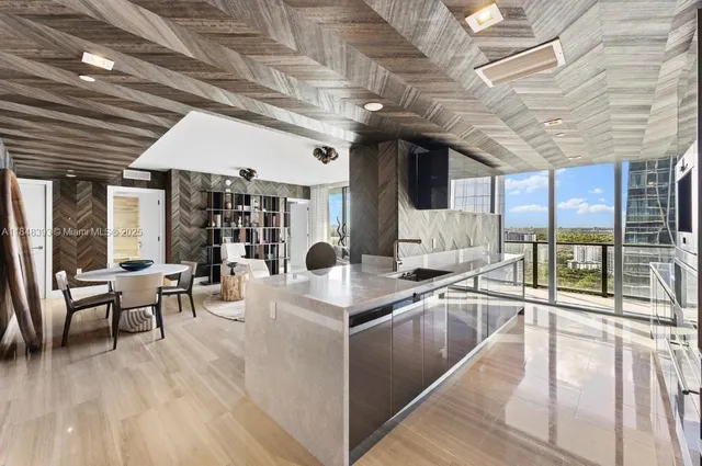 a view of a dining hall with many windows