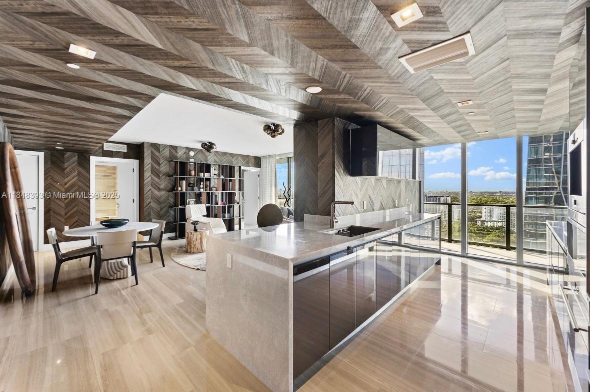 1451 Brickell Avenue, Unit 2505 Miami, FL 33131 - Photo 4 of 30 a view of a dining hall with many windows