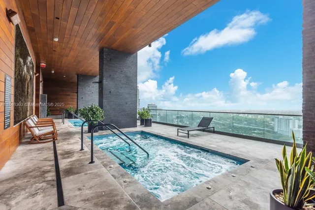a bathroom with a bathtub and shower