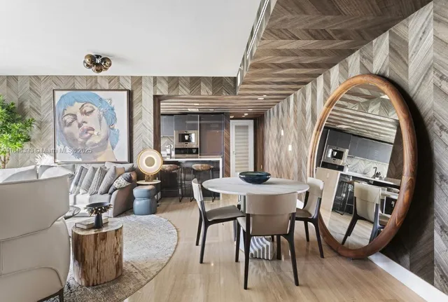 a bathroom with a sink double vanity granite tub shower and a mirror