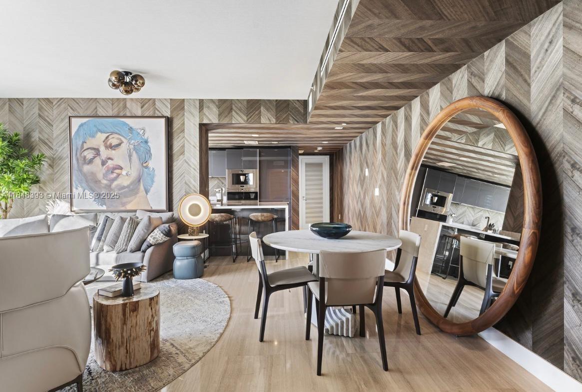 1451 Brickell Avenue, Unit 2505 Miami, FL 33131 - Photo 10 of 30 a living room with furniture and wooden floor