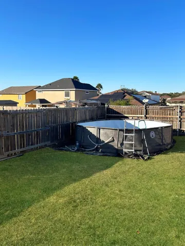 a view of a house with a yard and sitting area