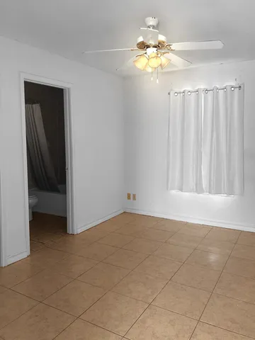 a view of a chandelier fan in a room