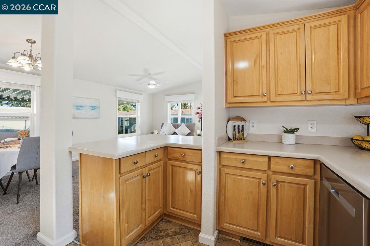 3777 Willow Pass Road, Unit 20 Bay Point, CA 94565 - Photo 12 of 35 a kitchen with white cabinets and sink
