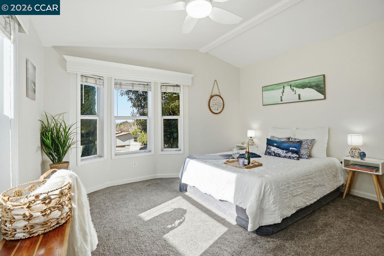 3777 Willow Pass Road, Unit 20 Bay Point, CA 94565 - Photo 16 of 35 a bedroom with a bed and a window