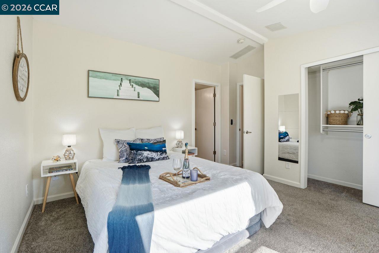 3777 Willow Pass Road, Unit 20 Bay Point, CA 94565 - Photo 17 of 35 a living room with furniture and wooden floor