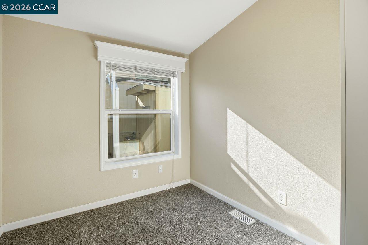 3777 Willow Pass Road, Unit 20 Bay Point, CA 94565 - Photo 19 of 35 a view of an empty room with a window