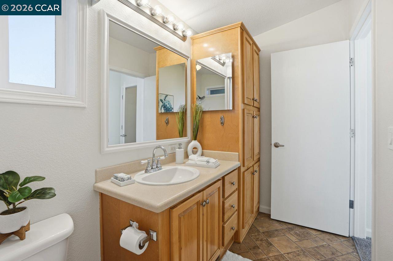 3777 Willow Pass Road, Unit 20 Bay Point, CA 94565 - Photo 23 of 35 a bathroom with a sink and a mirror