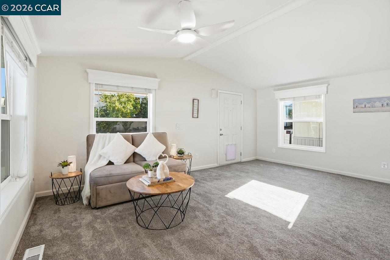 3777 Willow Pass Road, Unit 20 Bay Point, CA 94565 - Photo 3 of 35 a living room with furniture and a window