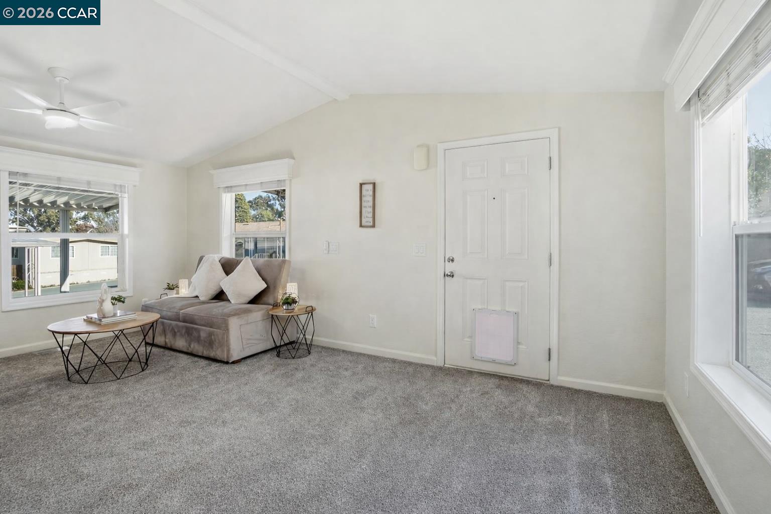 3777 Willow Pass Road, Unit 20 Bay Point, CA 94565 - Photo 4 of 35 a living room with furniture and windows