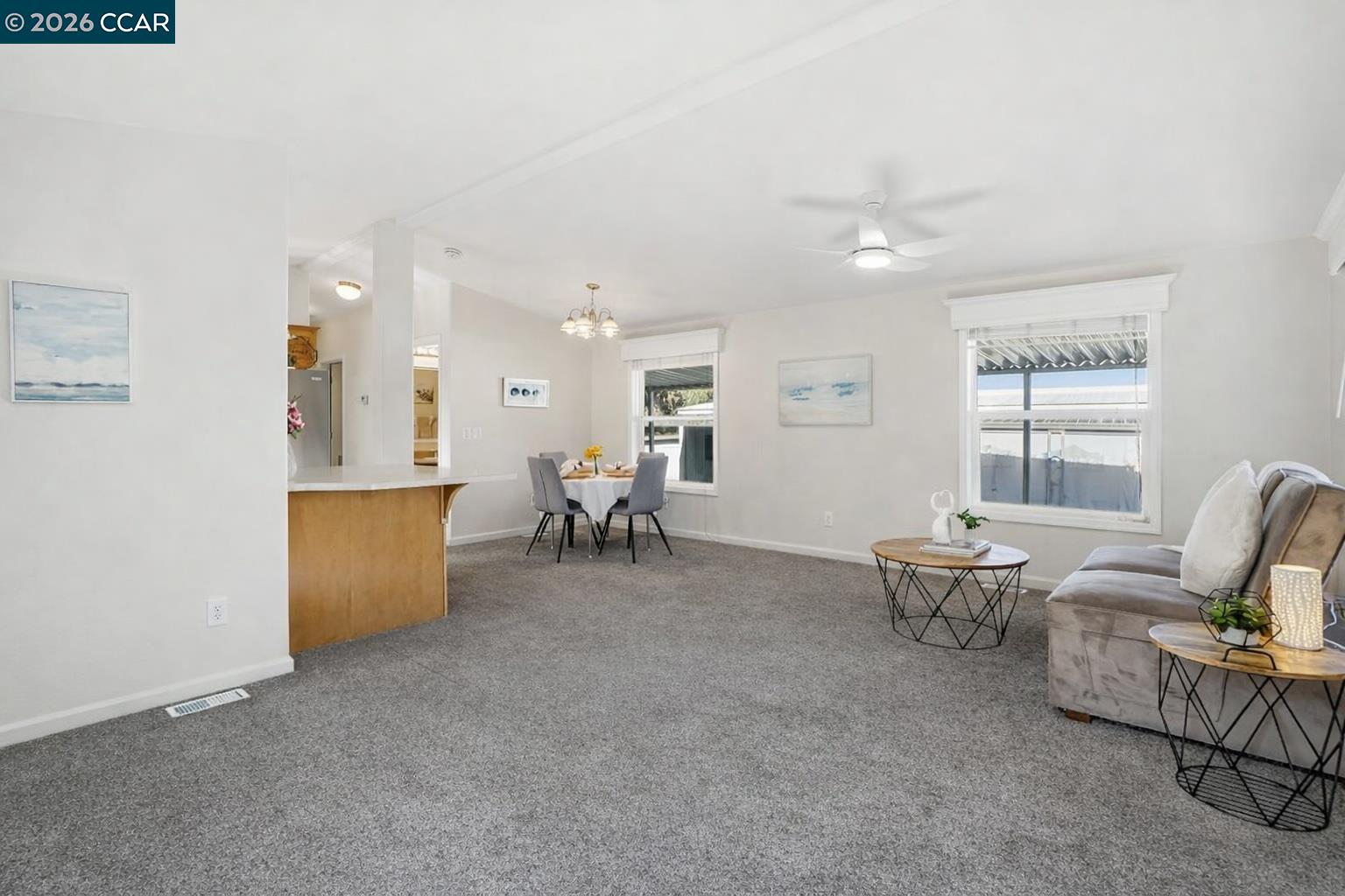 3777 Willow Pass Road, Unit 20 Bay Point, CA 94565 - Photo 5 of 35 a living room with furniture and a table