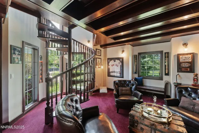 a kitchen with a table chairs refrigerator and cabinets
