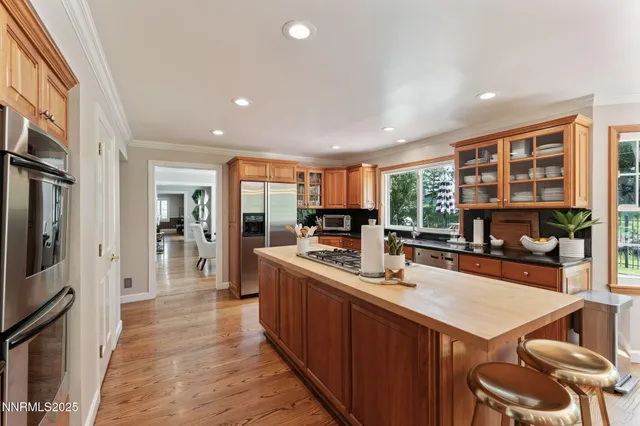 a bedroom with a large bed and a large window