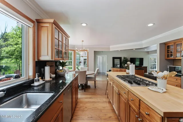 a spacious bathroom with a bathtub and chandelier