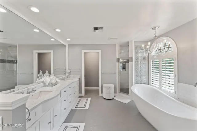 a view of a chair and table in the patio