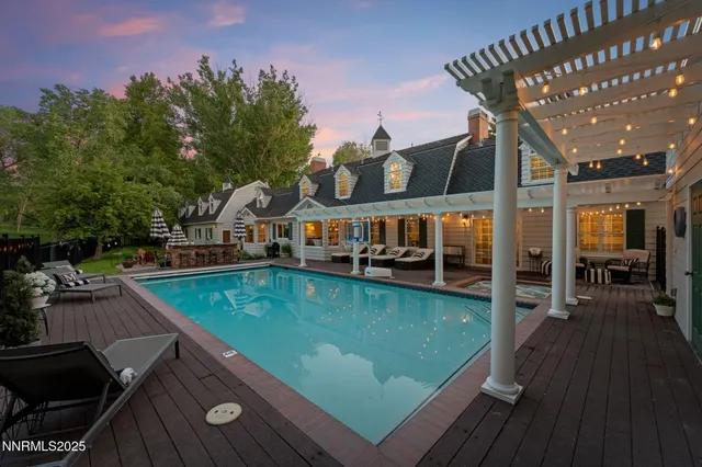 a room with pool table and wooden floor