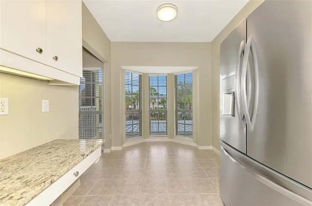 a bathroom with a glass door shower a sink and a mirror
