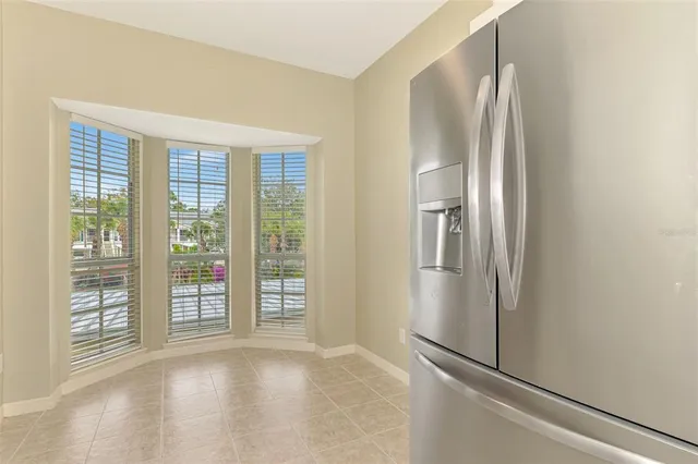 a kitchen with a refrigerator and a sink