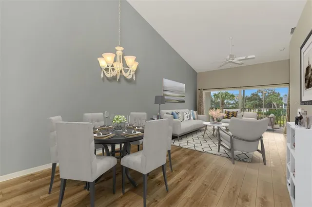 a view of a dining room with furniture window and wooden floor