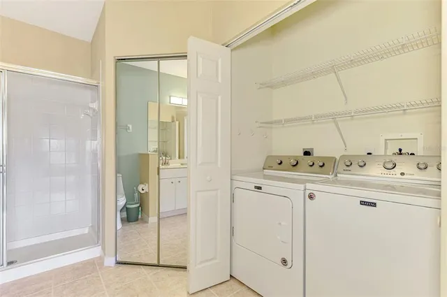 an empty room with a window and a ceiling fan