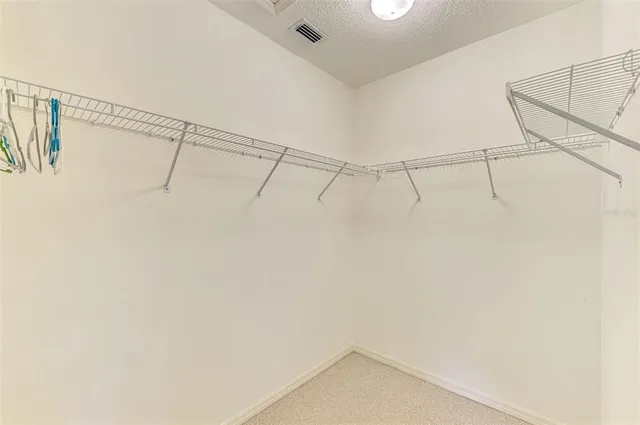 a bathroom with a sink a toilet a mirror a bathtub and shower