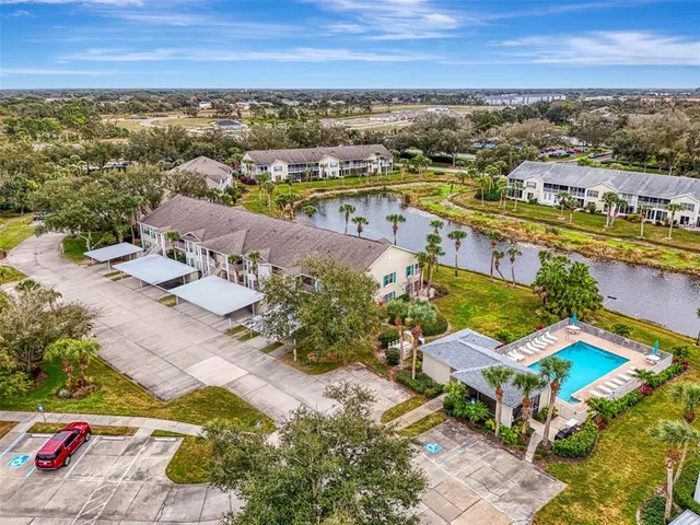 an aerial view of residential houses with outdoor space
