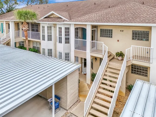 a balcony view with a seating space