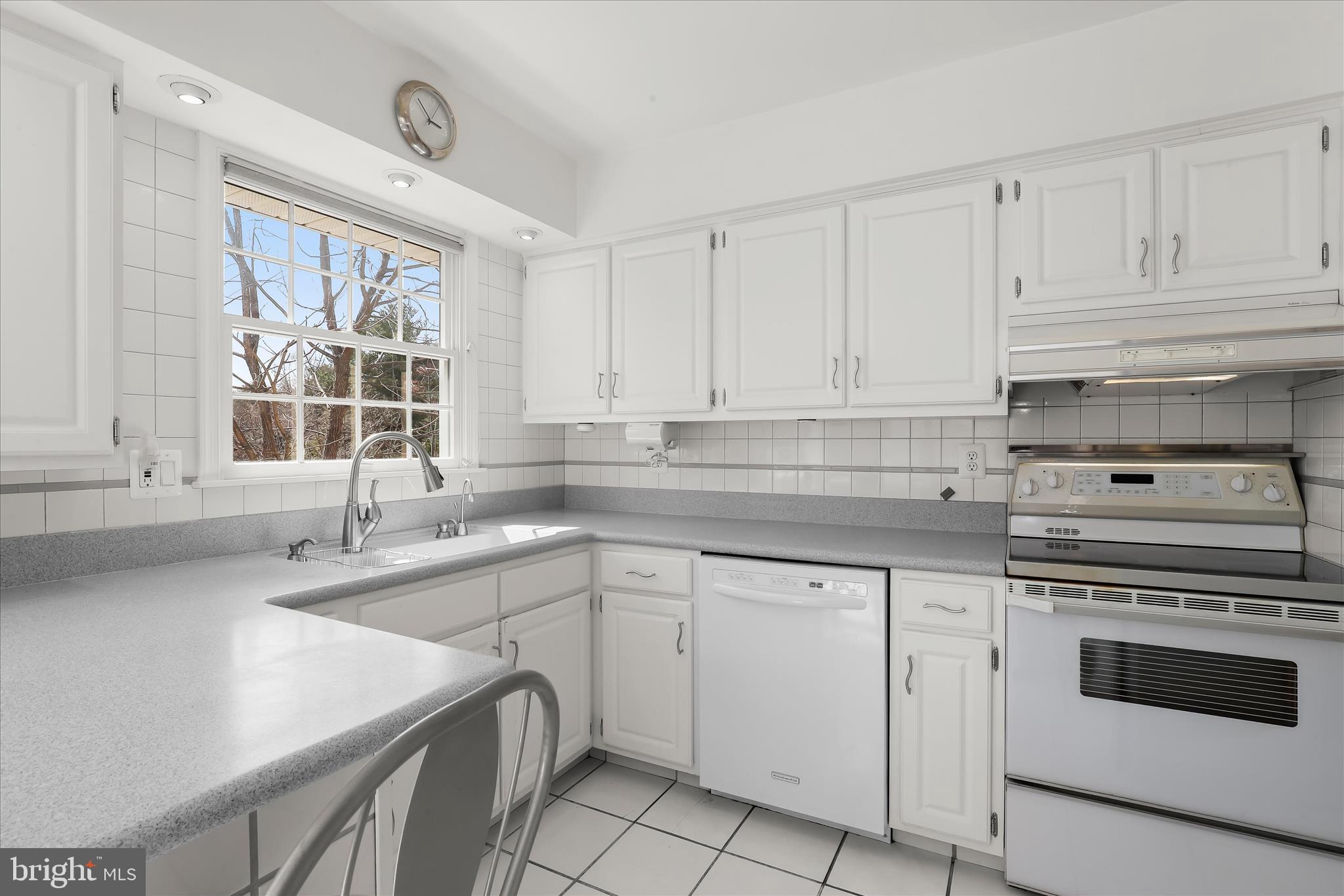 13612 Jacobs Road Mount Airy, MD 21771 - Photo 16 of 90 a kitchen with white cabinets and white appliances