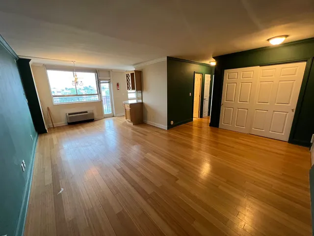 a view of a livingroom with a kitchen