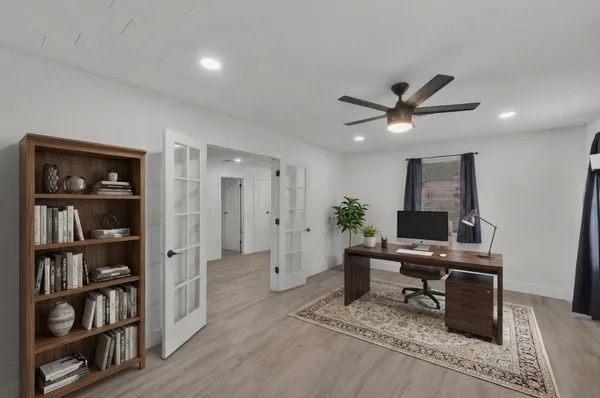 a work room with furniture and wooden floor