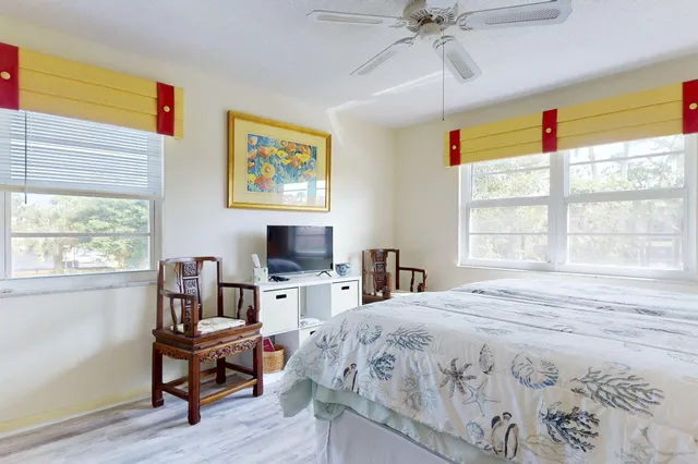 a bedroom with a large bed and a window