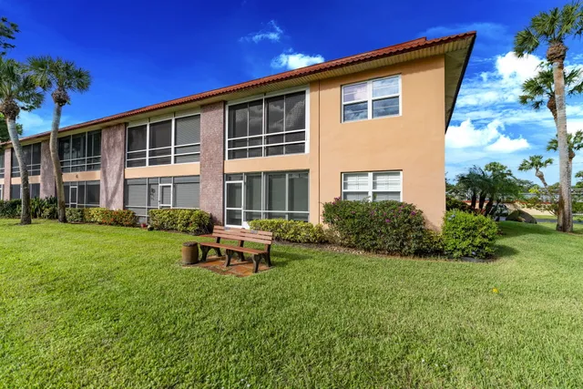 a view of a park with large trees and a big yard