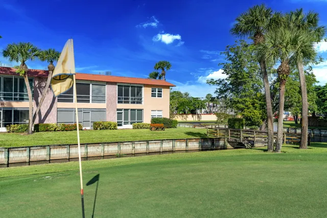 a view of a lake with a house in the background