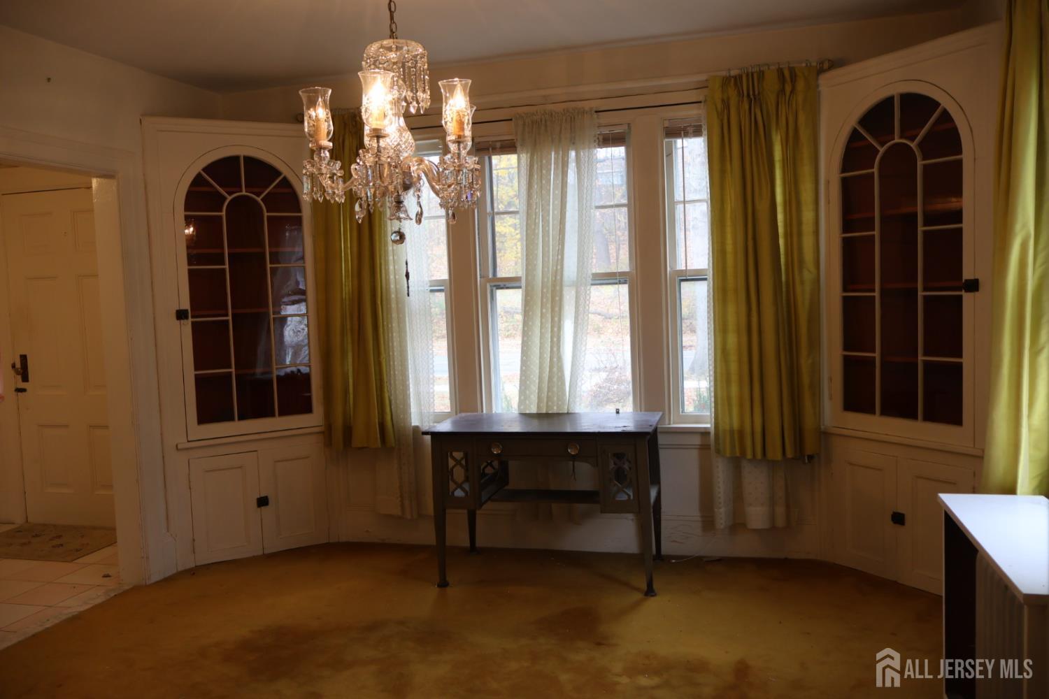 40 Prospect Street Summit, NJ 07901 - Photo 6 of 17 a view of a room with a large window and chandelier