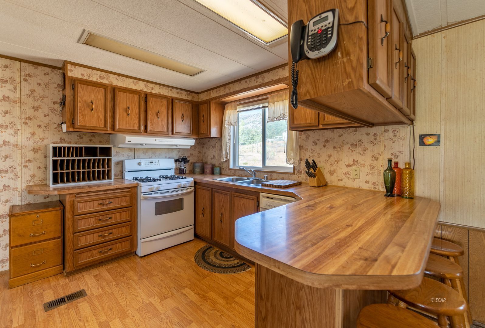 659 Spring Valley Lane Spring Creek, NV 89815 - Photo 8 of 25 a kitchen that has a table and chairs in it