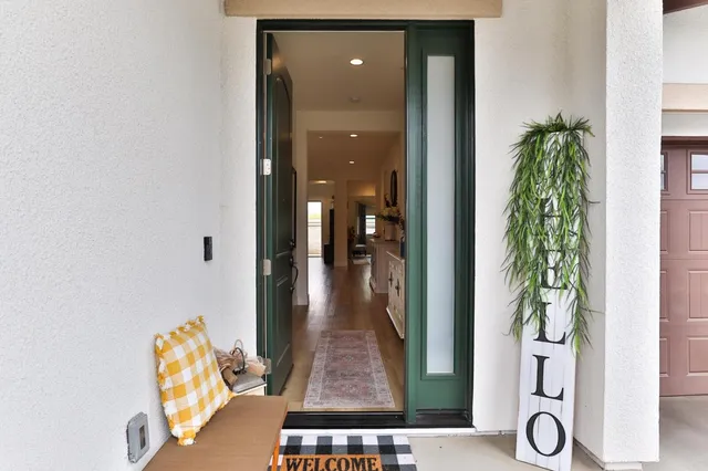 a view of a living room and entryway